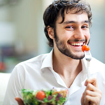 happy man eating a salad
